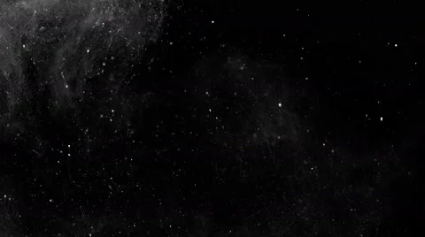 Ink and dust floating slowly in space on black background, 4k Видео 68791841
