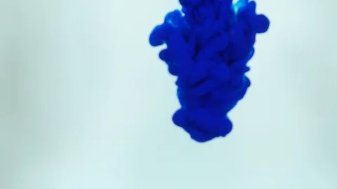 Ink being poured into water,phantom flex. Blue,white. Inks in water. Colorful ab Stock Footage 85579255