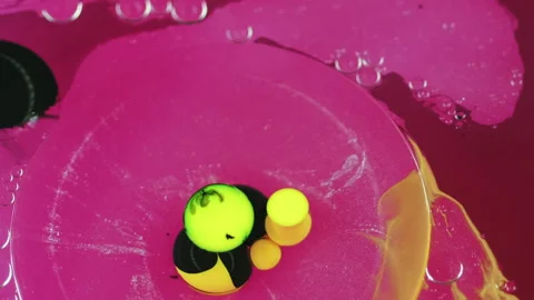 Ink blend background liquid pigment pink yellow Stock Footage 260881005