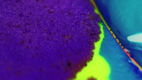 Ink blend glitter paint wave purple blue yellow Stock Footage 276044491