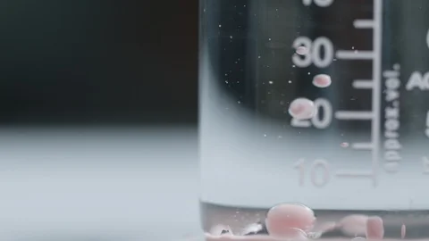 Ink Bubbles in Measuring Flask Macro Stock Footage