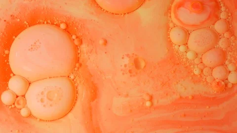 Ink Bubbles In Water. Orange Bubbles.Bright Collors Bubbles Oil Beautiful Paint  Stock Footage 86390288