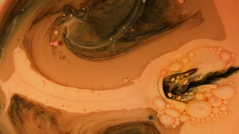 Ink Bubbles In Water. Orange Bubbles.Bright Collors Bubbles Oil Beautiful Paint  Stock Footage 87422233