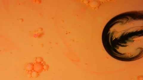 Ink Bubbles In Water. Orange Bubbles.Bright Collors Bubbles Oil Beautiful Paint  Stock Footage 87422250