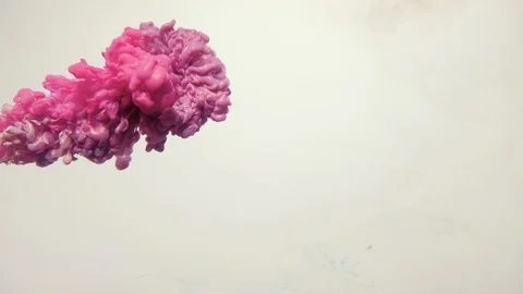 Ink cloud in water glitter pink fume motion white Stock Footage 120129026