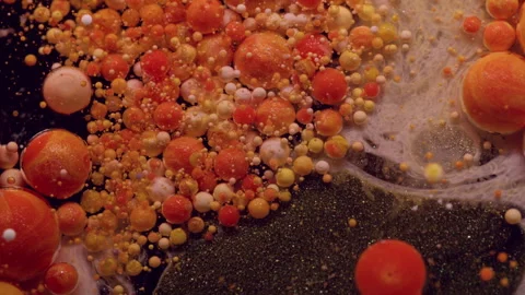 Ink dissolving paint bubble burst glitter spill Video stock 318308580