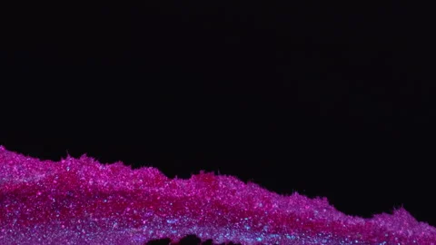 Ink drip glitter fluid pouring purple paint spill Stock Footage 265018720