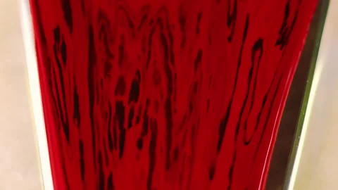 Ink drip paint spill red black gloss fluid flow Stock Footage 267790816