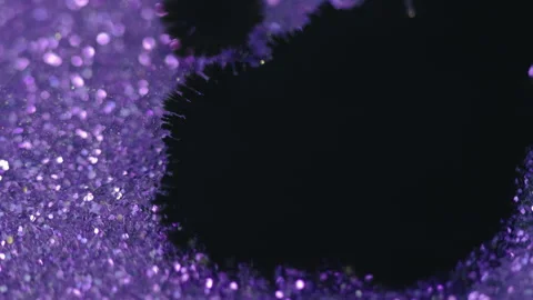 Ink drop paint splatter black purple bokeh light Stock Footage 264962164