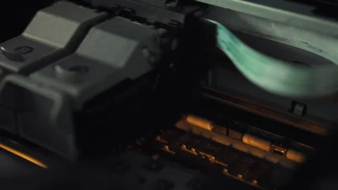 Ink-filled cartridges are inserted into a printer enabling a precise printin Video stock 331354162