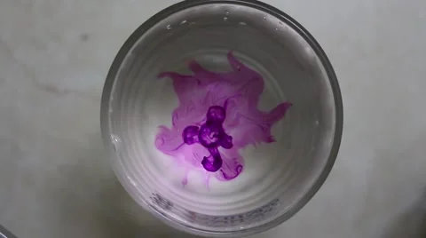 Ink in a glass of water Stock Footage 56081492