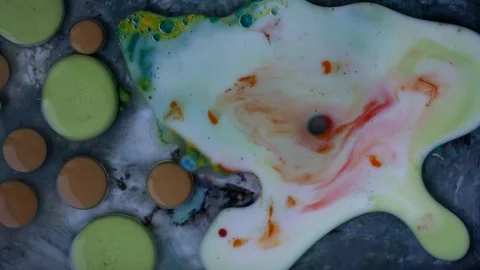 Ink green and red liquid bubbles spreading. video. Stock Footage 123777982