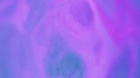 Ink liquid shiny fluid flow pink purple dye blend Stock Footage 288166926