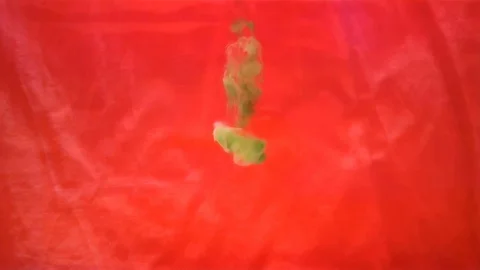 Ink motion on red background Stock Footage 88984213