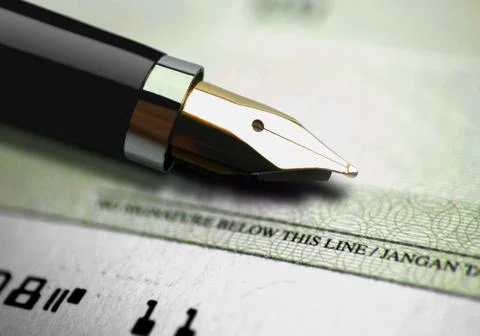 Ink pen on a cheque Stock Photos