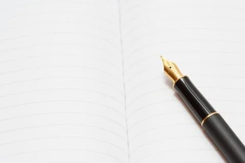 Ink pen on the notepad Stock Photos