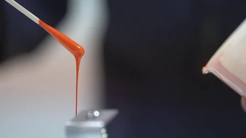 Ink Proofing - Applying the Ink Sample to a Hand Proofer Stock Footage 76863540