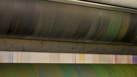 Ink rollers at high speed in a printing factory printing newspapers Stock Footage 121808514