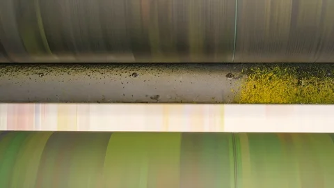 Ink rollers at high speed in a printing factory printing newspapers Stock Footage 121809065