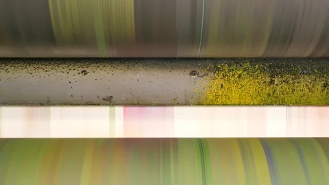 Ink rollers at high speed in a printing factory printing newspapers Stock Footage 121809103
