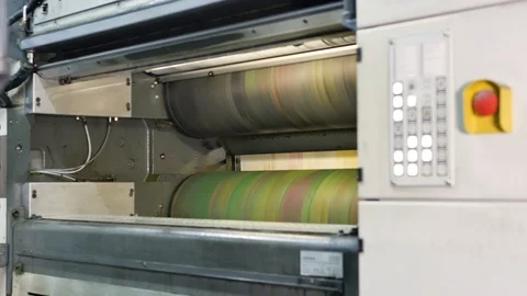 Ink rollers at high speed in a printing factory printing newspapers Stock Footage 121809388