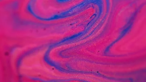 Ink spill liquid glitter mix paint pink blue wave Video stock 282115072