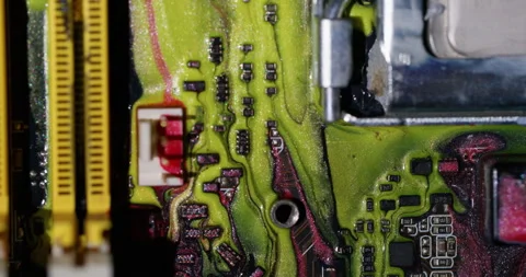 Ink spill processor chip motherboard color liquid Stock Footage 318416643