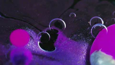 Ink splash glitter oil bubbles neon purple pink Stock Footage 276147548