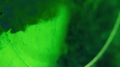 Ink splash oil bubbles neon smoke green blue paint Stock-Footage 278499791