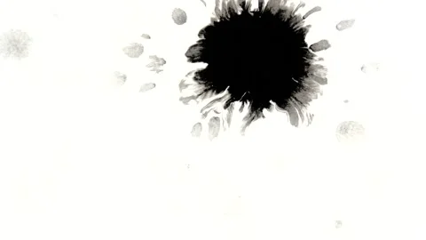 Ink splattering on white background. Black inks and clean white paper 스톡 동영상 106488847