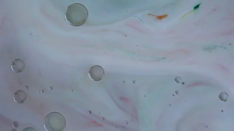 Ink transparent oil bubbles slowly floating in liquid. video. Stock Footage 123777902