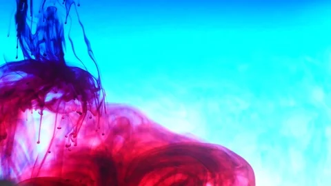 Ink in water. Colour ink reacting in water creating abstract cloud formations Stock Footage