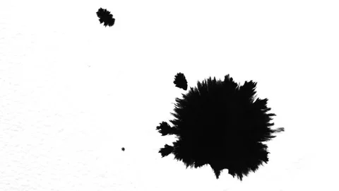 Inkdrop spreading on paper Stock Footage 87669666