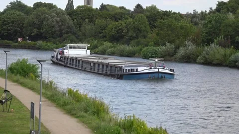 Inland cargo ship on the canal Stock Footage 283663363