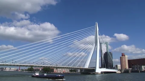 Inland ship moving downstream under Erasmus bridge ROTTERDAM Stock Footage 55123891