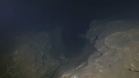 Inlet between two rocks On The Rocky Bottom Of The Cave,Risorgenza Amaseno,Italy Stock Footage 224354872
