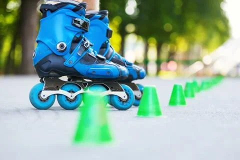 Inline roller skater on a slalom course Foto stock