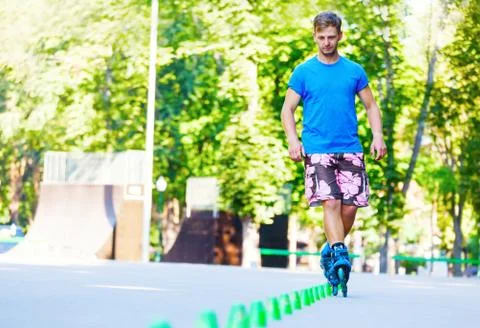 Inline roller skater on a slalom course Stock-Fotos