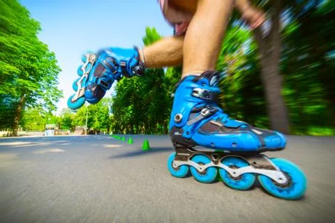 Inline roller skater on a slalom course Foto stock