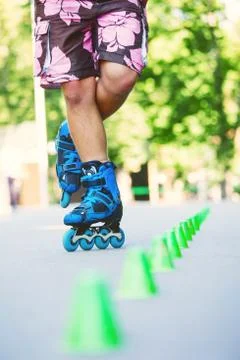 Inline roller skater on a slalom course Stock-Fotos