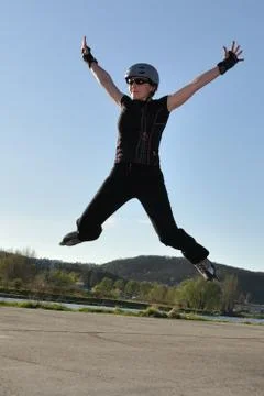 Inline skate wide jump 스톡 사진