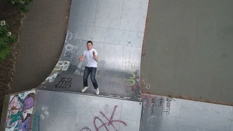 Inline skater backflip birds eye drone aerial Stock Footage 107613397