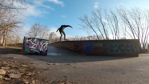 Inline skater doing trick at the skatepark on aggressive skates Stock Footage 122511479