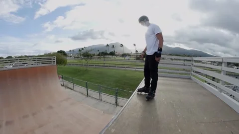 Inline skater Pro  rollerblader on half pipe skating skater flips Video stock 136333573