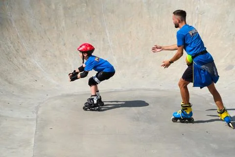 Inline Skating Coach Training Young Skater at Skatepark Stock Photos