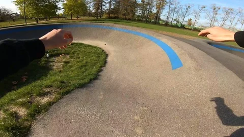 Inline Skating riding on Asphalt Pumptrack on Rollerblades POV Stockbeeldmateriaal 120445415