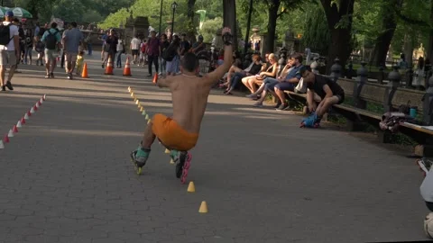 InLine Skating Tricks Squat Through Cones Stock Footage 245996356