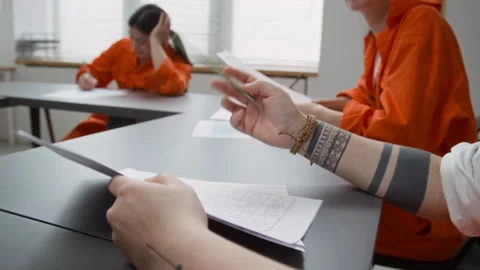 Inmate Attending Prison Education Class and Doing English Tasks Stock Footage 328987717