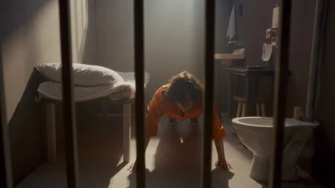 Inmate Doing Push-Ups on Floor in Prison Cell during Incarceration Stock Footage 310336129