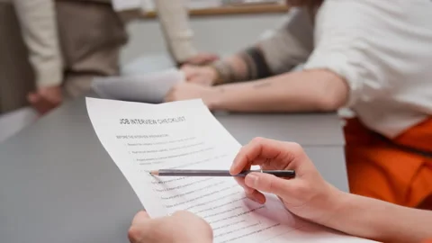 Inmate Reading Job Interview Checklist in Class at Prison Stock Footage 328998521